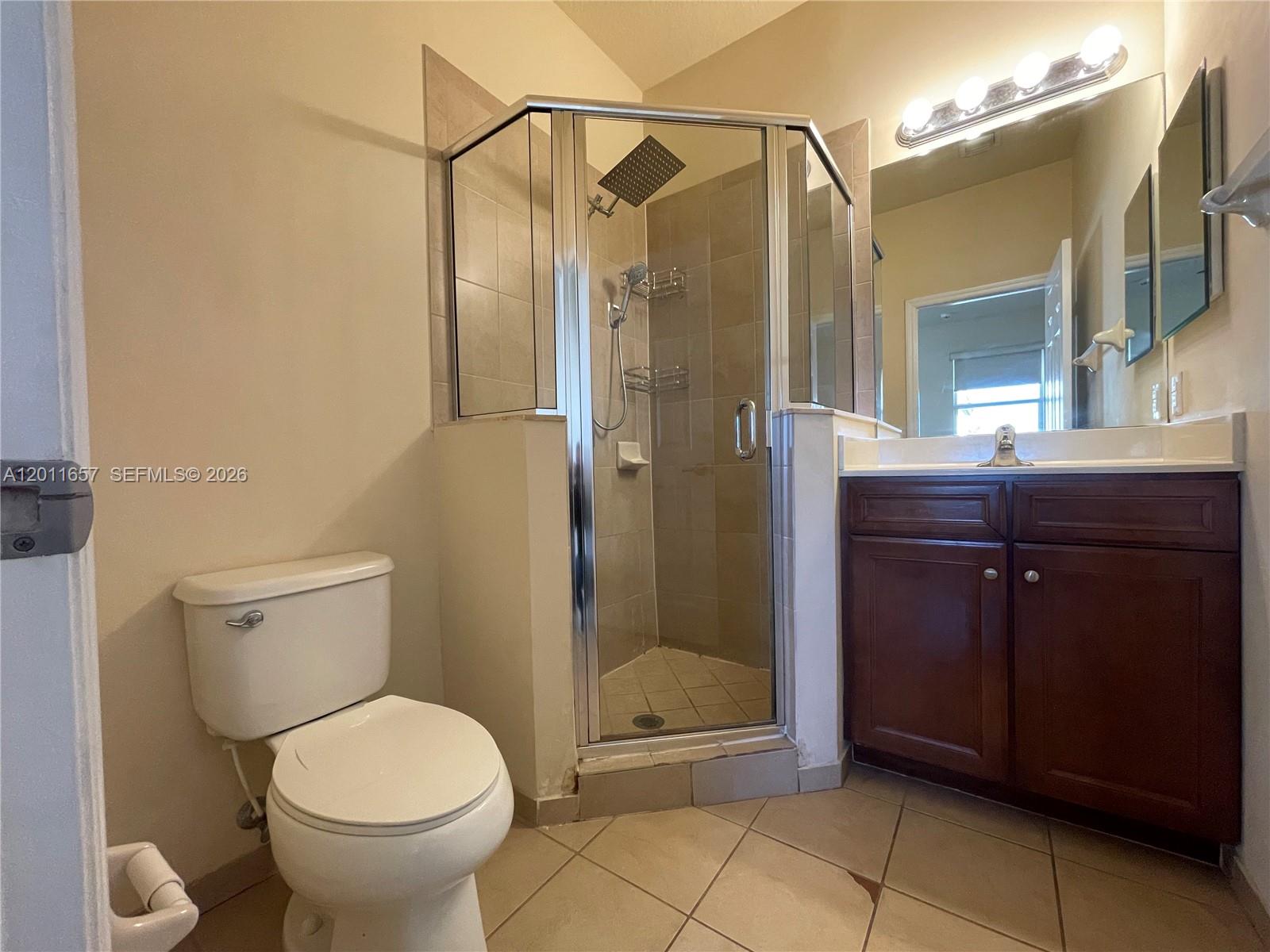 9262 Southwest 171st Court, Unit A Miami, FL 33196 - Photo 6 of 7 a bathroom with a toilet and a shower
