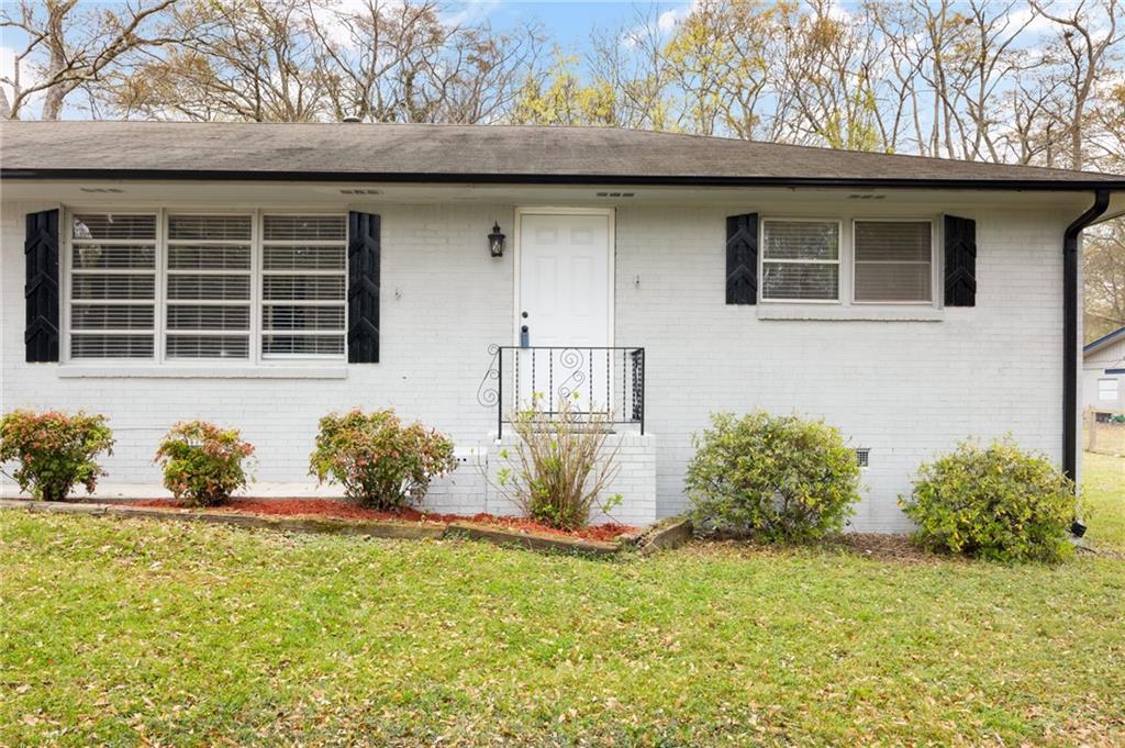 a front view of a house with a yard