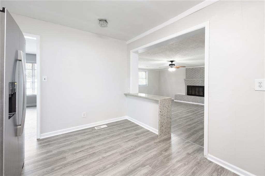 4611 Old Westside Road Austell, GA 30106 - Photo 14 of 37 a view of a big room with wooden floor and a bathroom