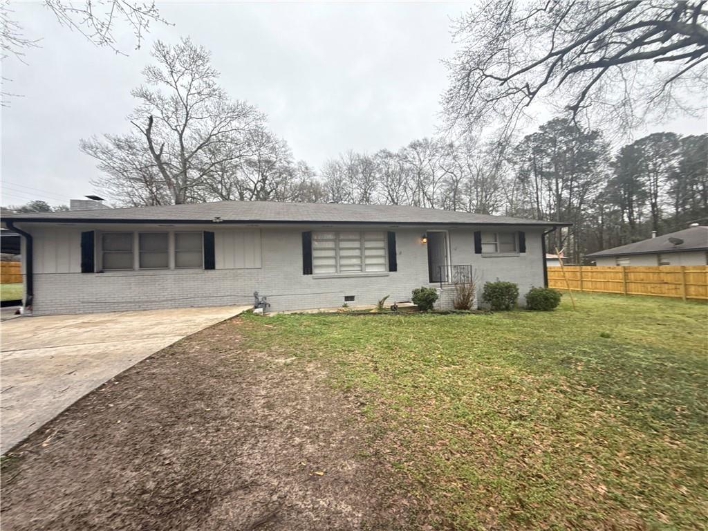 4611 Old Westside Road Austell, GA 30106 - Photo 2 of 37 a front view of house with yard and trees around