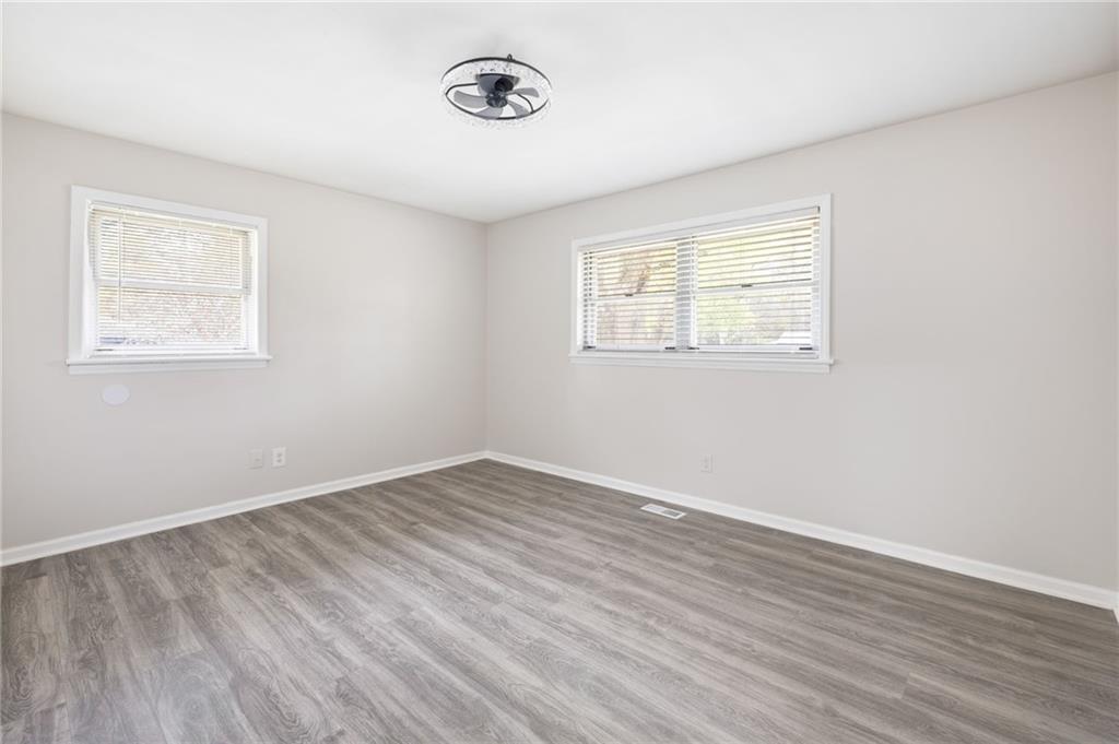 4611 Old Westside Road Austell, GA 30106 - Photo 23 of 37 wooden floor in an empty room with a window