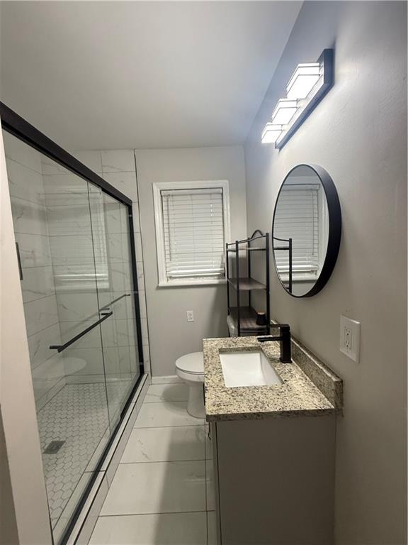 4611 Old Westside Road Austell, GA 30106 - Photo 24 of 37 a bathroom with a granite countertop sink and a mirror