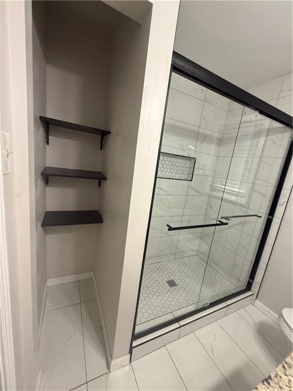 4611 Old Westside Road Austell, GA 30106 - Photo 25 of 37 a view of walk in closet with empty racks