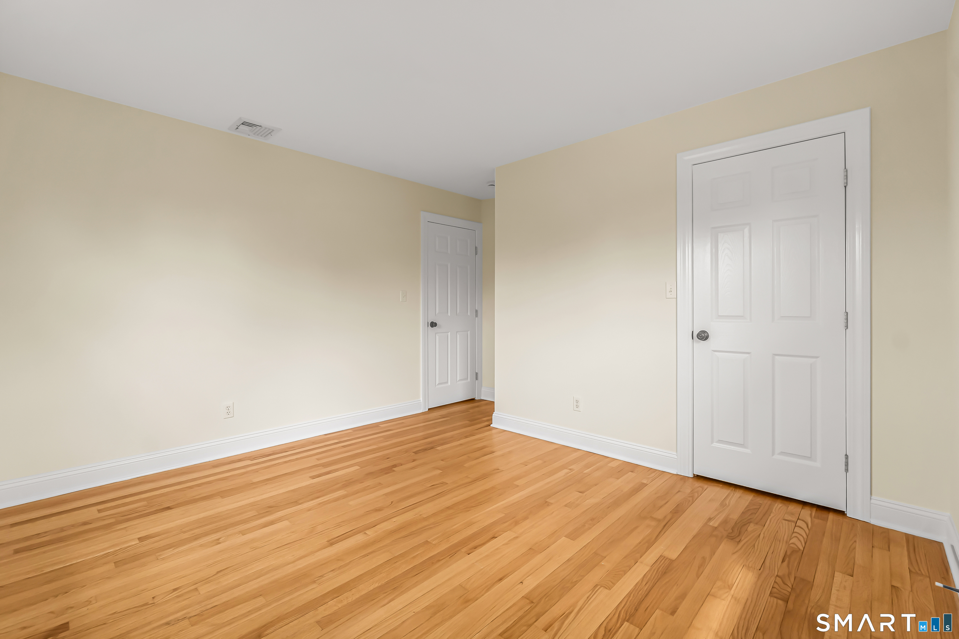 15 Bruns Road Ansonia, CT 06401 - Photo 16 of 39 a view of an empty room with wooden floor