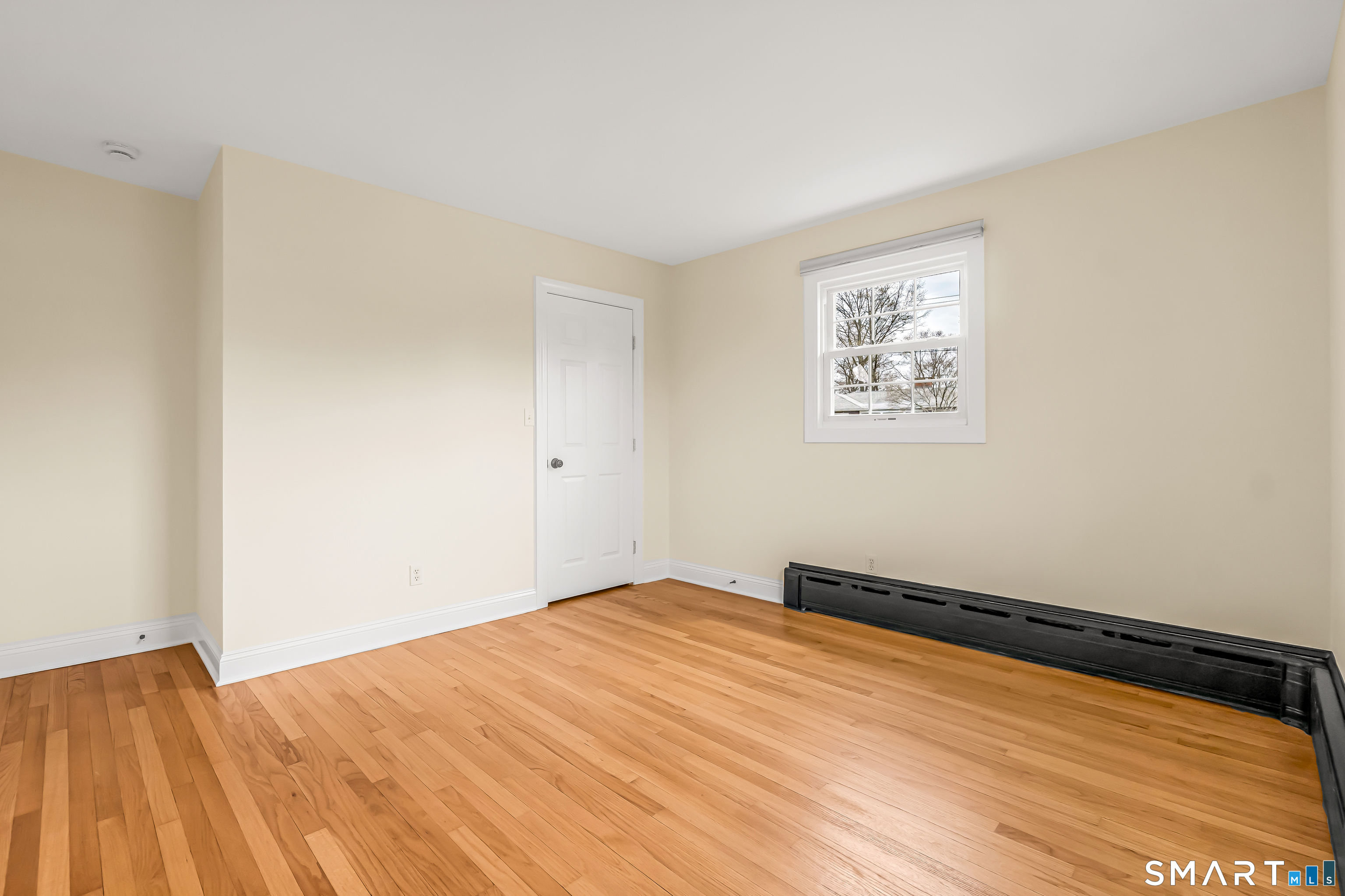 15 Bruns Road Ansonia, CT 06401 - Photo 17 of 39 a view of empty room with wooden floor