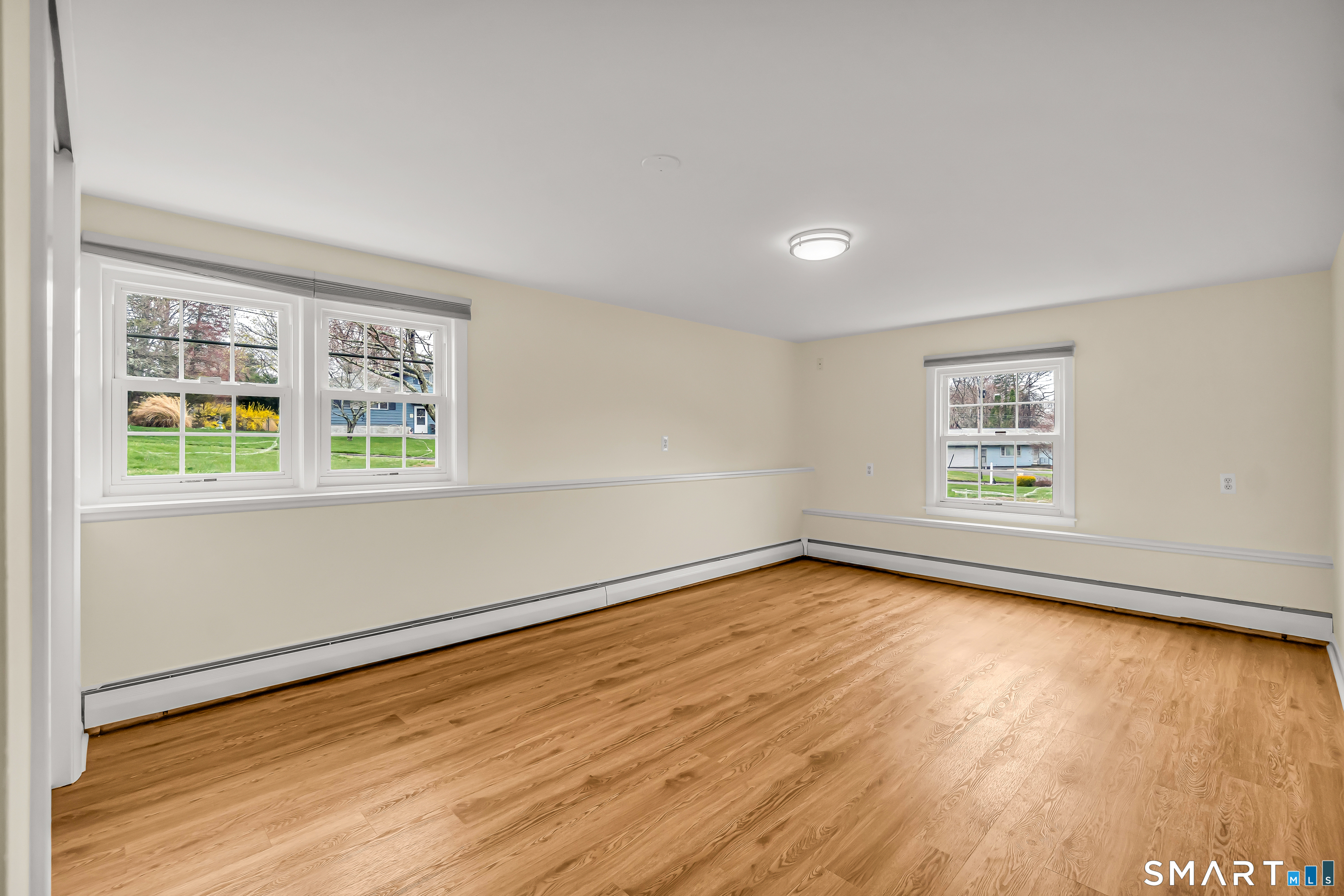 15 Bruns Road Ansonia, CT 06401 - Photo 24 of 39 a view of an empty room with wooden floor and a window