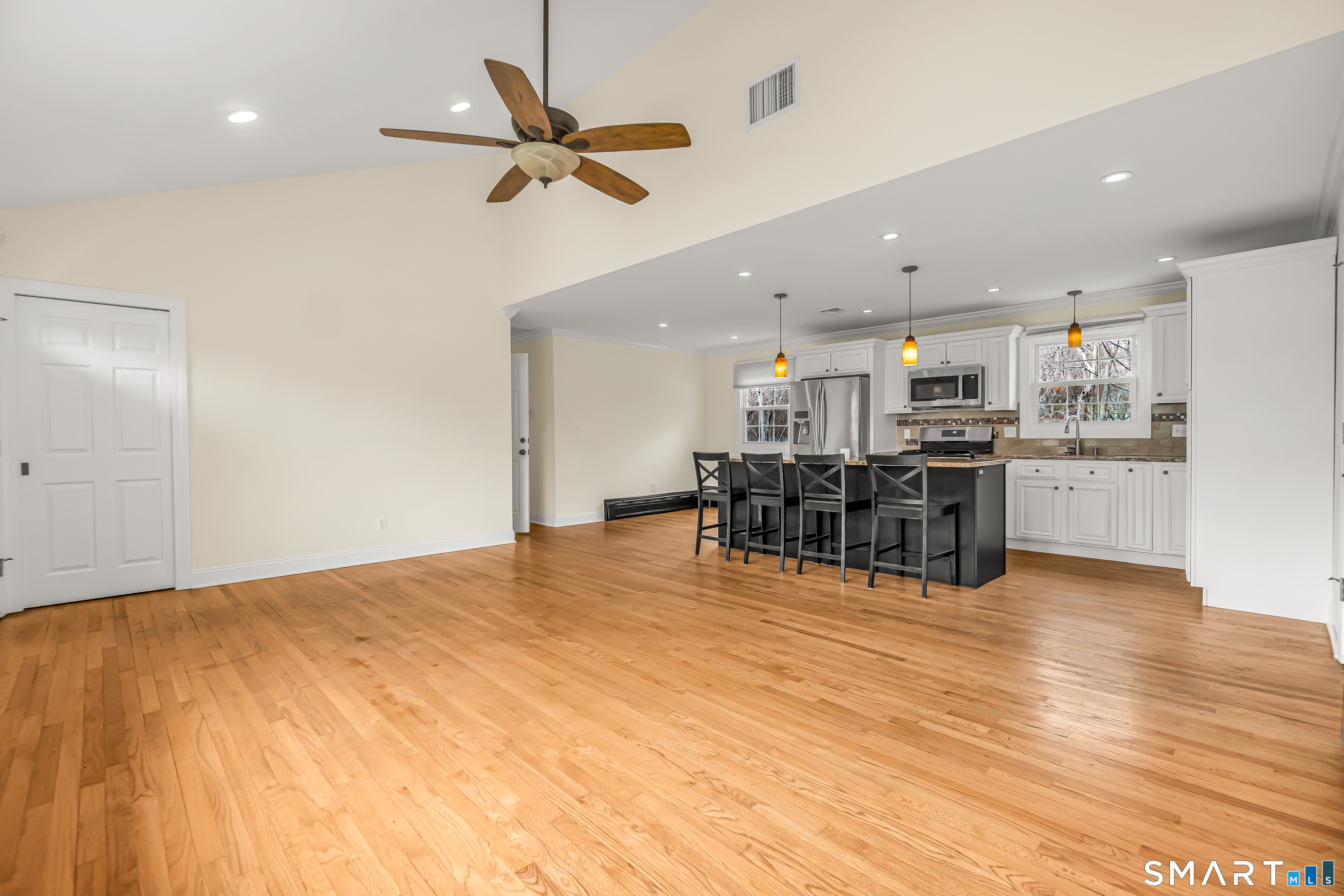 15 Bruns Road Ansonia, CT 06401 - Photo 4 of 39 a view of a room with wooden floor and furniture