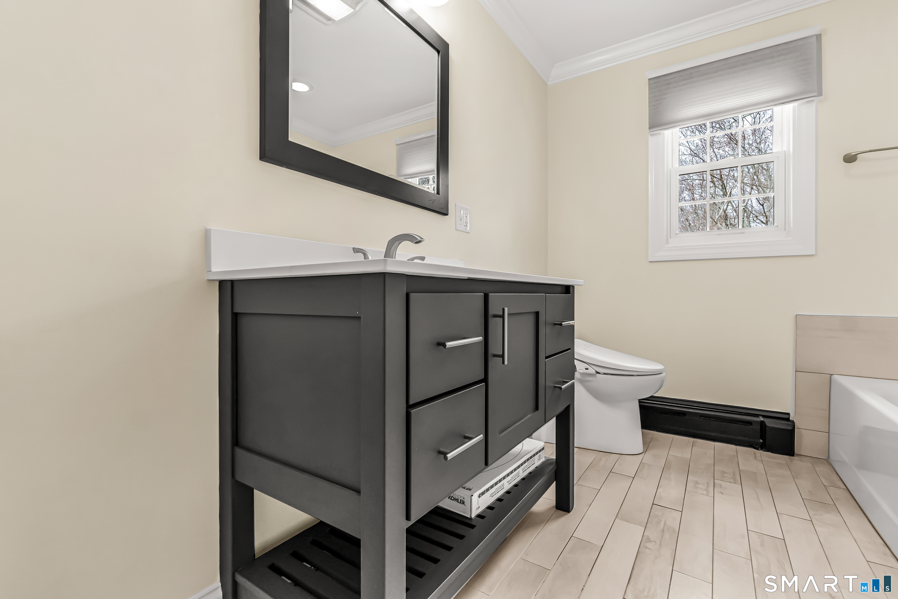 15 Bruns Road Ansonia, CT 06401 - Photo 6 of 39 a bathroom with a sink a toilet and mirror