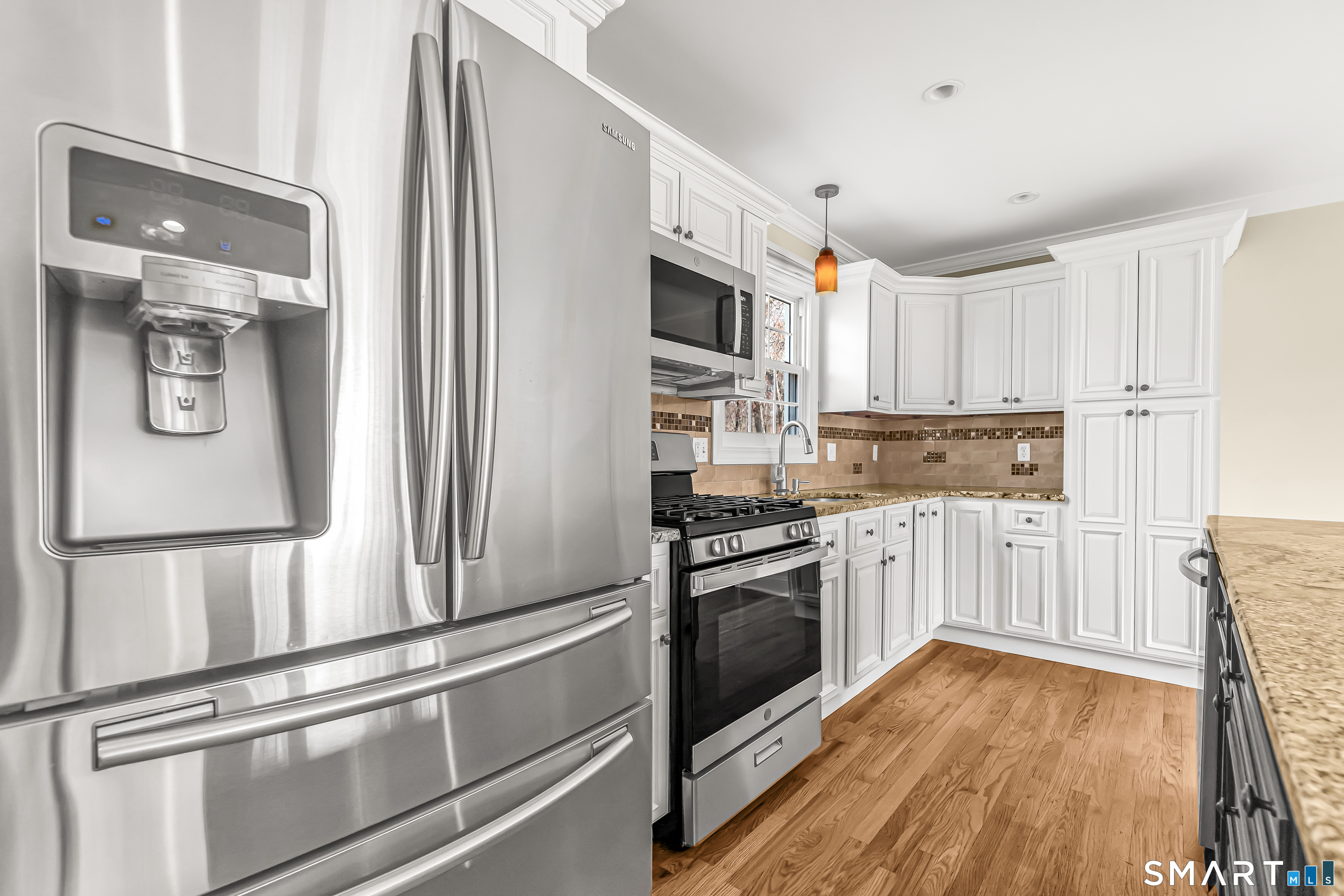 15 Bruns Road Ansonia, CT 06401 - Photo 9 of 39 a kitchen with stainless steel appliances a refrigerator sink and microwave