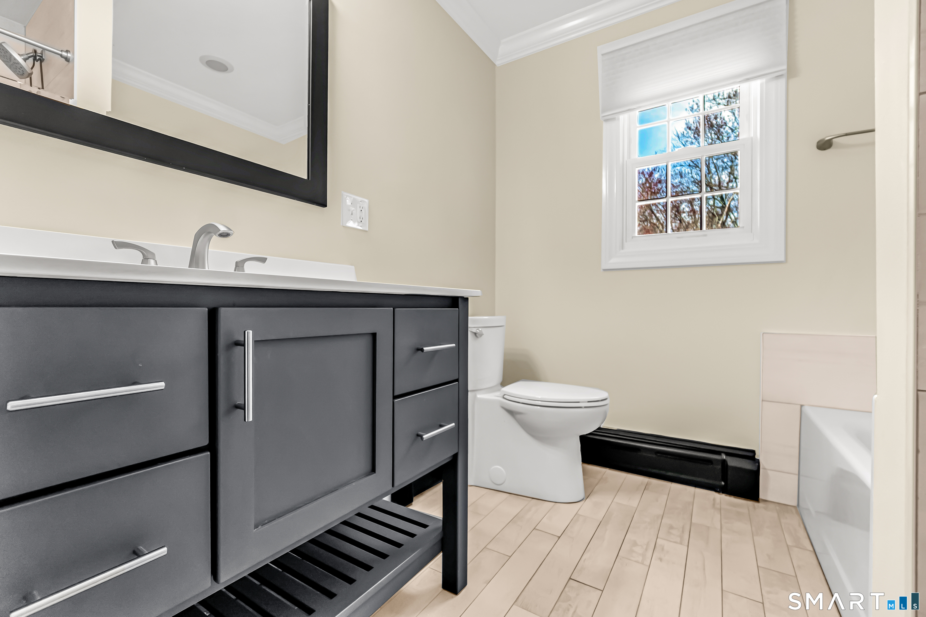 15 Bruns Road Ansonia, CT 06401 - Photo 10 of 39 a bathroom with a toilet a sink and mirror