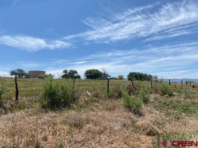a view of a lake with green space
