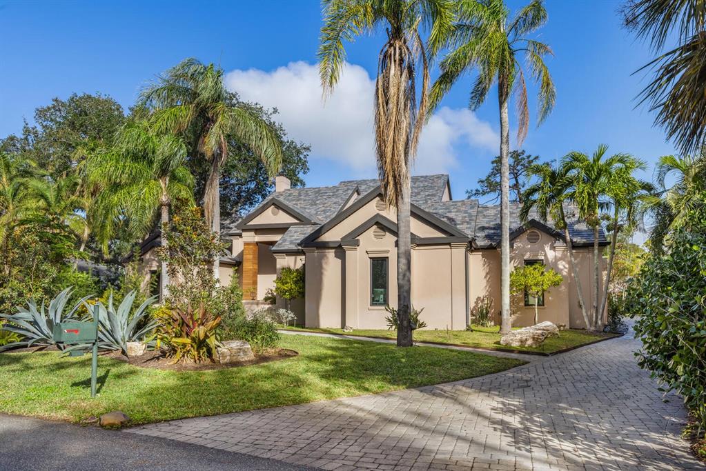 49 Osprey Point Drive Osprey, FL 34229 - Photo 54 of 95 a front view of a house with garden