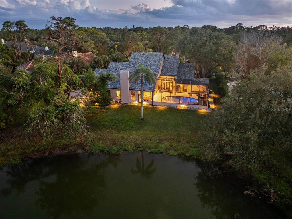 49 Osprey Point Drive Osprey, FL 34229 - Photo 82 of 95 an aerial view of residential houses with outdoor space and lake view