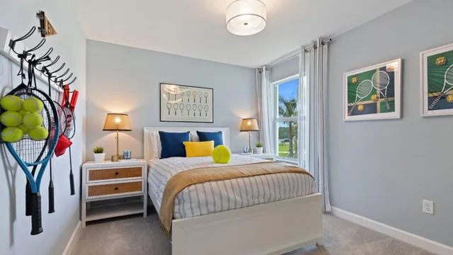 a bedroom with a bed and a painting on the wall