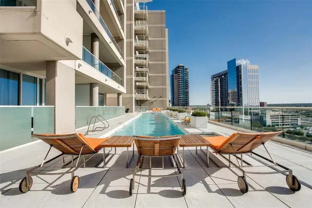 a view of a patio with a table and chairs