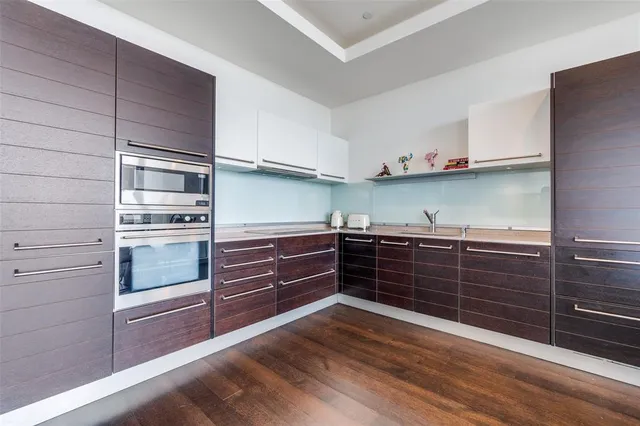 a kitchen with granite countertop stainless steel appliances and cabinets