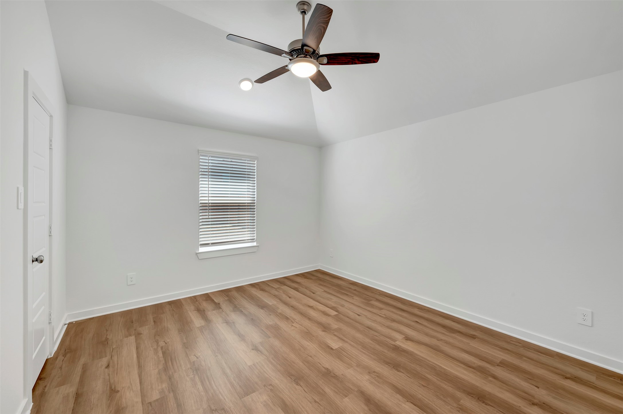 716 Hackberry Branch Magnolia, TX 77354 - Photo 11 of 32 wooden floor in an empty room with a window