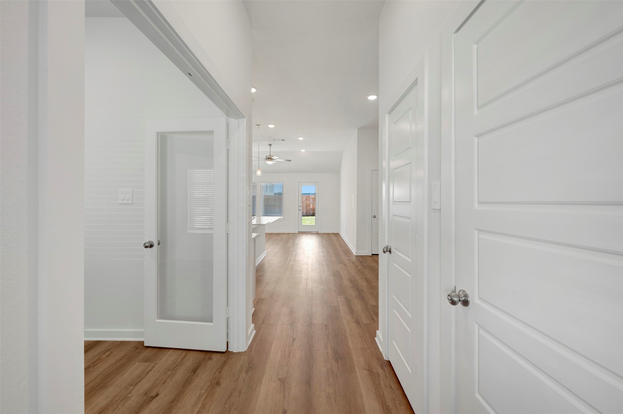 716 Hackberry Branch Magnolia, TX 77354 - Photo 15 of 32 a view of a hallway with wooden floor