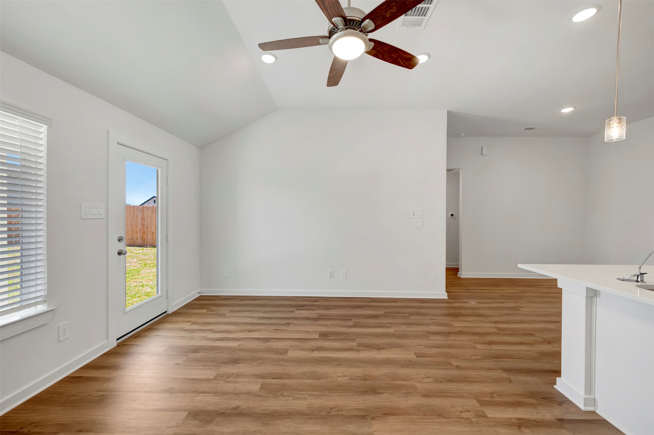 716 Hackberry Branch Magnolia, TX 77354 - Photo 22 of 32 a view of an empty room with wooden floor and a window