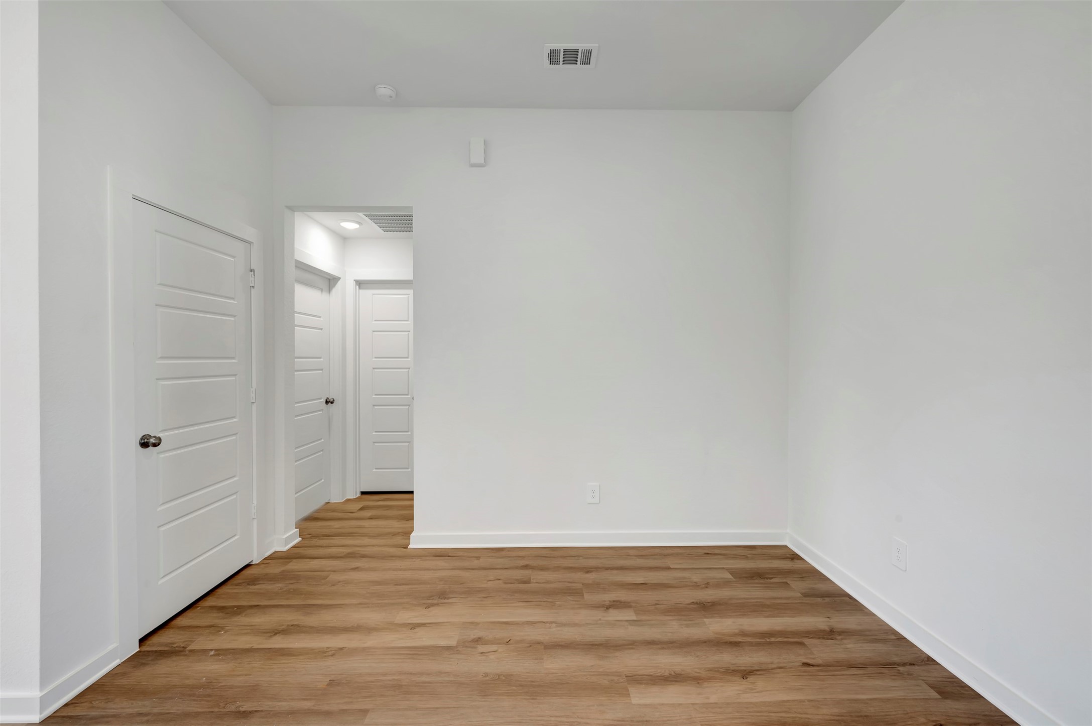 716 Hackberry Branch Magnolia, TX 77354 - Photo 27 of 32 a view of an empty room with wooden floor and a window