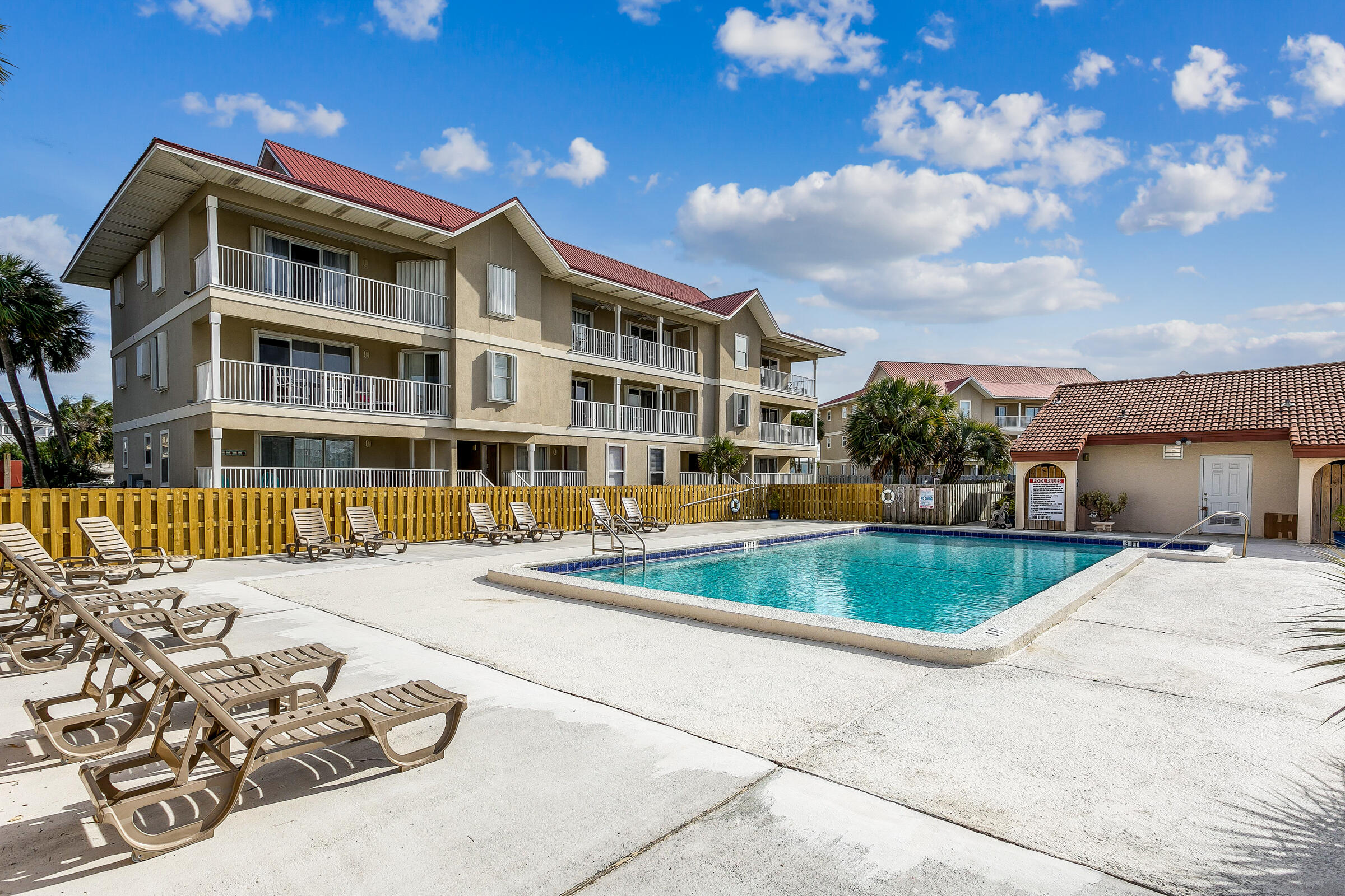 7453 Sunset Harbor Drive, Unit 2203 Navarre, FL 32566 - Photo 7 of 21 a front view of a house with a yard