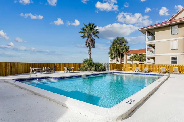 a view of swimming pool with outdoor seating