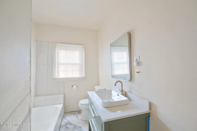 a bathroom with a sink and a toilet