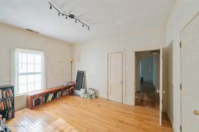 a room with a bed and a window