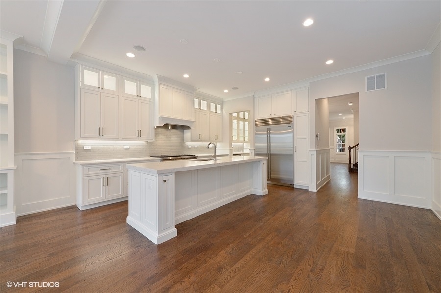 2143 North Racine Avenue, Unit 1 Chicago, IL 60614 - Photo 2 of 10 a kitchen with a refrigerator sink and cabinets