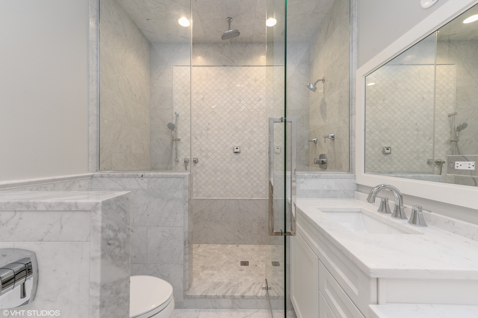 2143 North Racine Avenue, Unit 1 Chicago, IL 60614 - Photo 4 of 10 a bathroom with a sink a toilet and shower