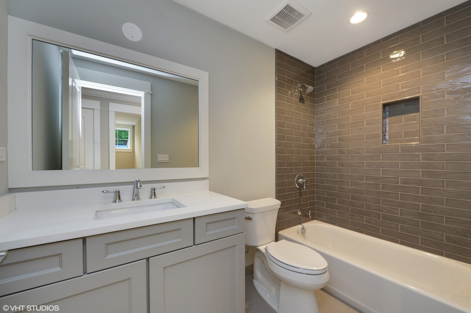 2143 North Racine Avenue, Unit 1 Chicago, IL 60614 - Photo 6 of 10 a bathroom with a sink a toilet and shower