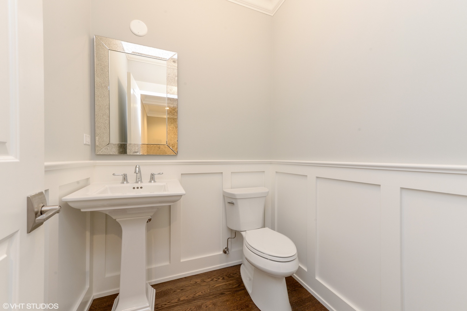 2143 North Racine Avenue, Unit 1 Chicago, IL 60614 - Photo 8 of 10 a bathroom with a toilet a sink and mirror