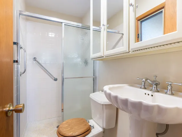 a bathroom with a sink and mirror