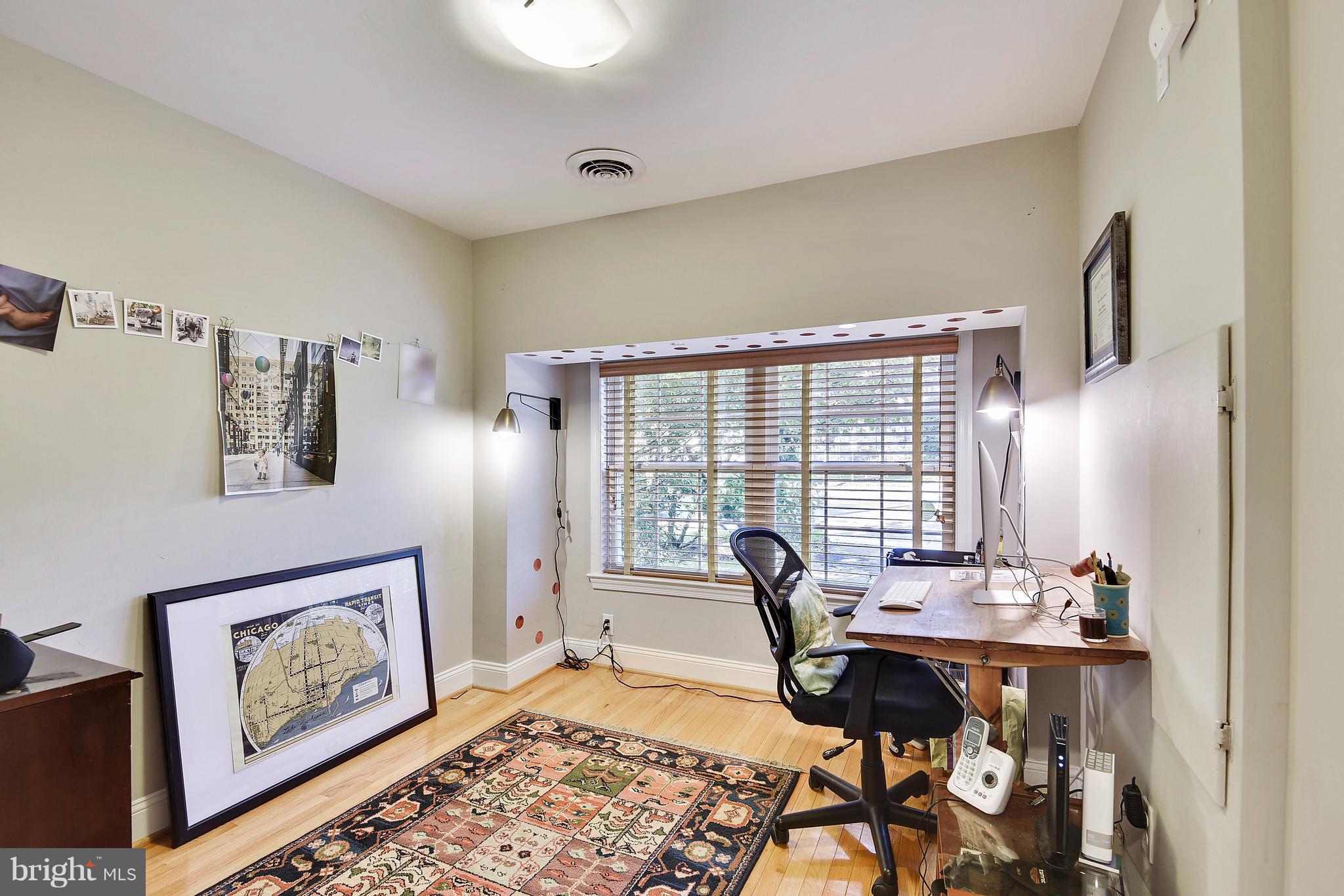 624 Wayne Avenue Silver Spring, MD 20910 - Photo 13 of 28 a view of a workspace with furniture and a window