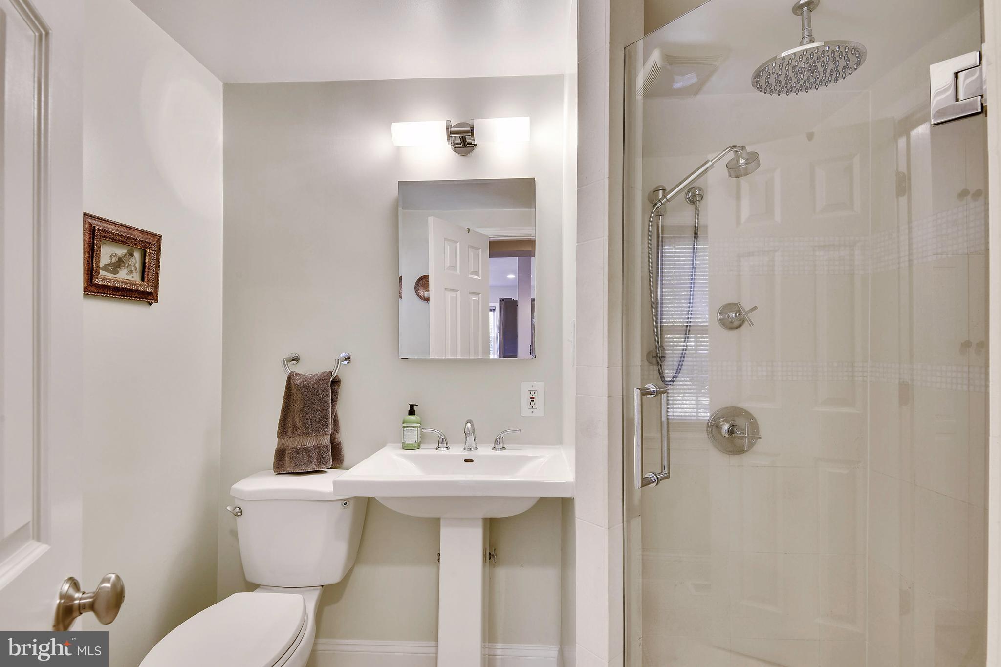 624 Wayne Avenue Silver Spring, MD 20910 - Photo 14 of 28 a bathroom with a sink toilet and shower
