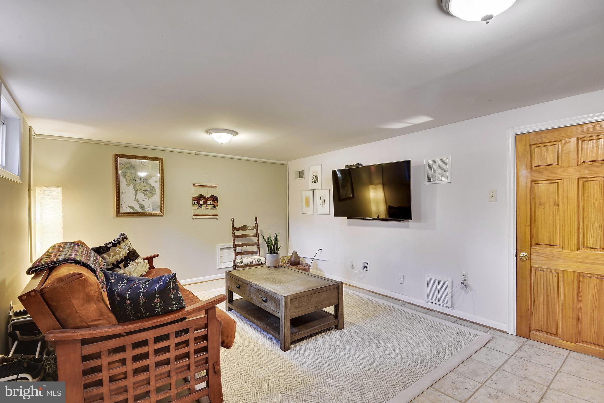 624 Wayne Avenue Silver Spring, MD 20910 - Photo 21 of 28 a living room with furniture and a flat screen tv