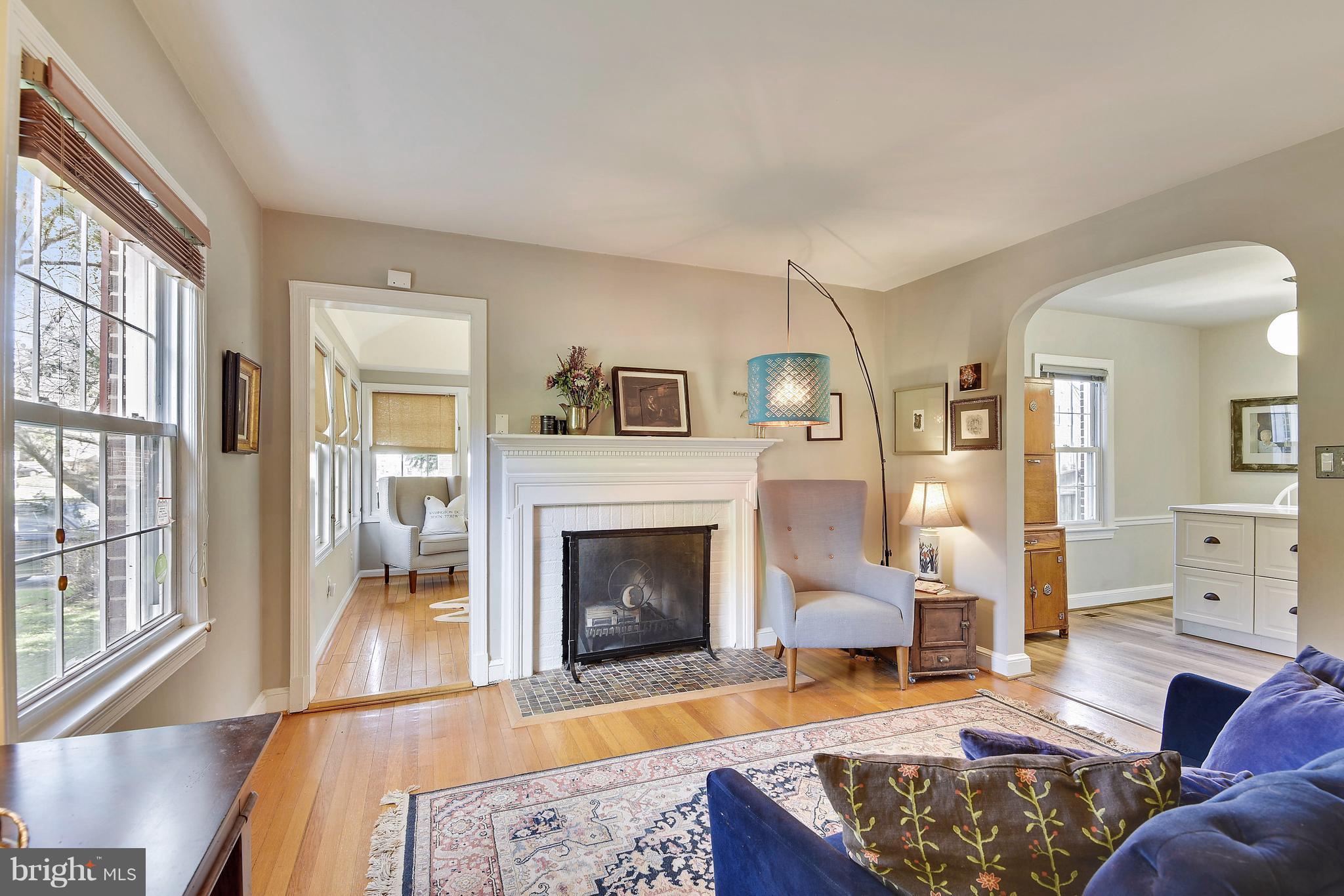 624 Wayne Avenue Silver Spring, MD 20910 - Photo 5 of 28 a living room with furniture or couch and a fireplace