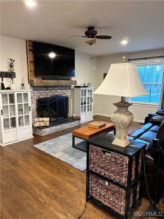 7379 Venable Road Kents Store, VA 23084 - Photo 9 of 28 a living room with furniture a fireplace and a flat screen tv