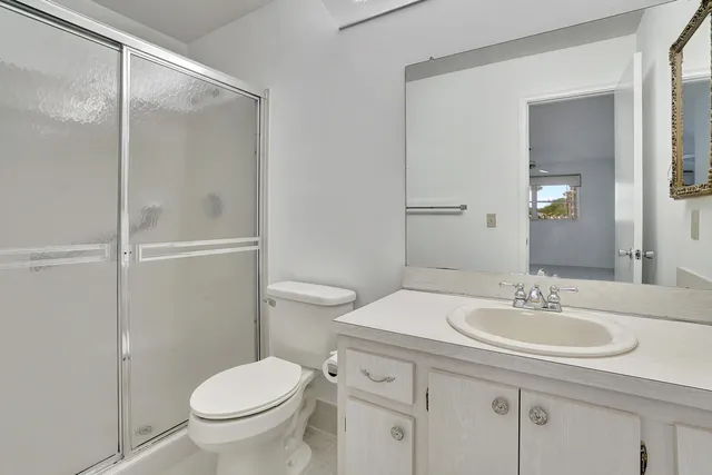 a bathroom with a sink toilet and vanity