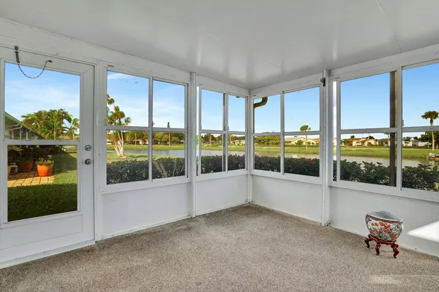 a view of an empty room with windows