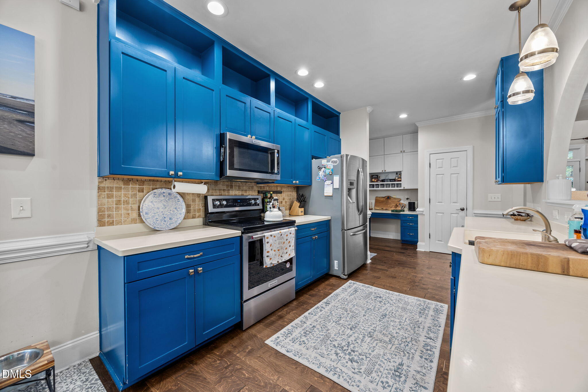 4620 Cresta Drive Raleigh, NC 27603 - Photo 13 of 39 a kitchen with granite countertop wooden cabinets a stove top oven a sink and dishwasher