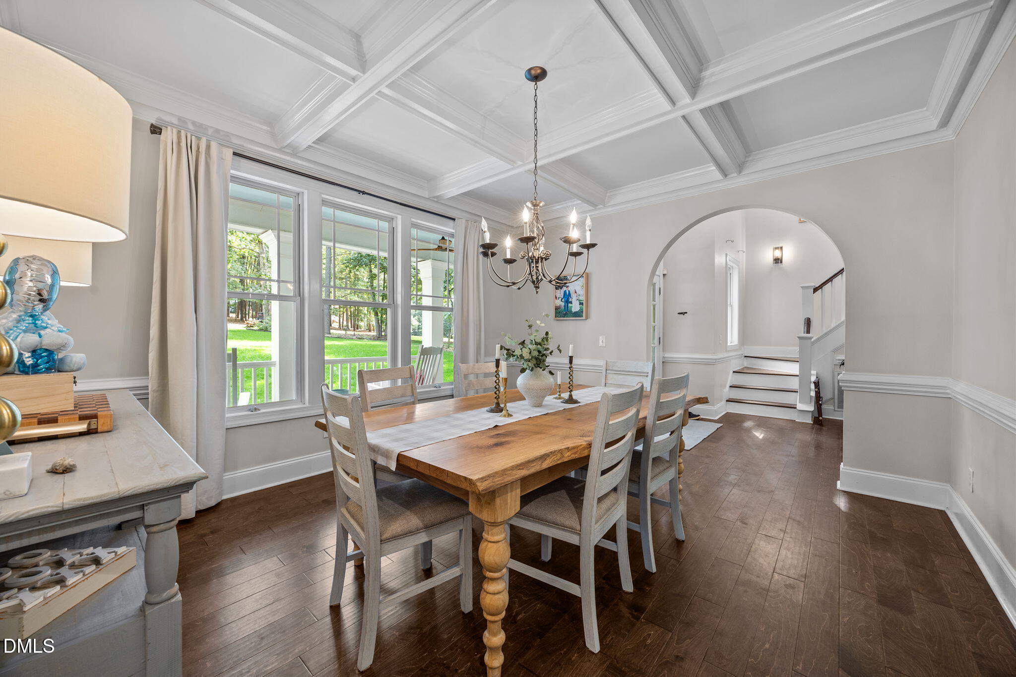 4620 Cresta Drive Raleigh, NC 27603 - Photo 15 of 39 a view of a dining room with furniture window and wooden floor