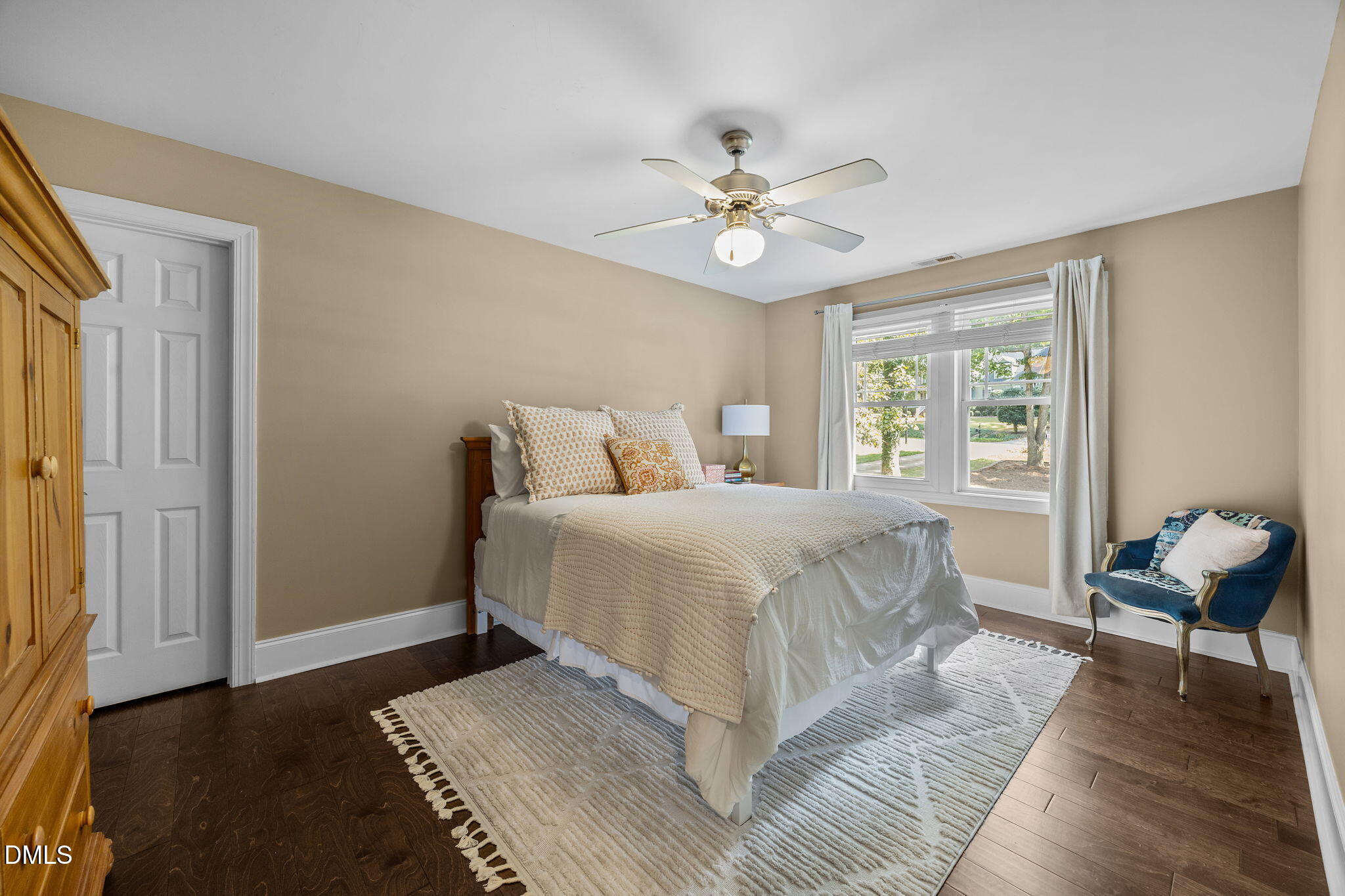 4620 Cresta Drive Raleigh, NC 27603 - Photo 20 of 39 a bedroom with a bed and wooden floor