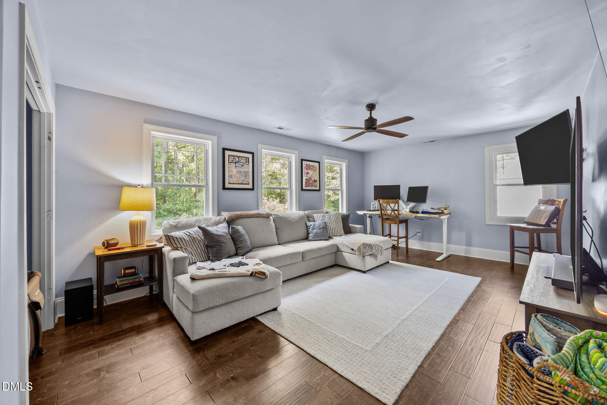 4620 Cresta Drive Raleigh, NC 27603 - Photo 22 of 39 a living room with furniture and a flat screen tv