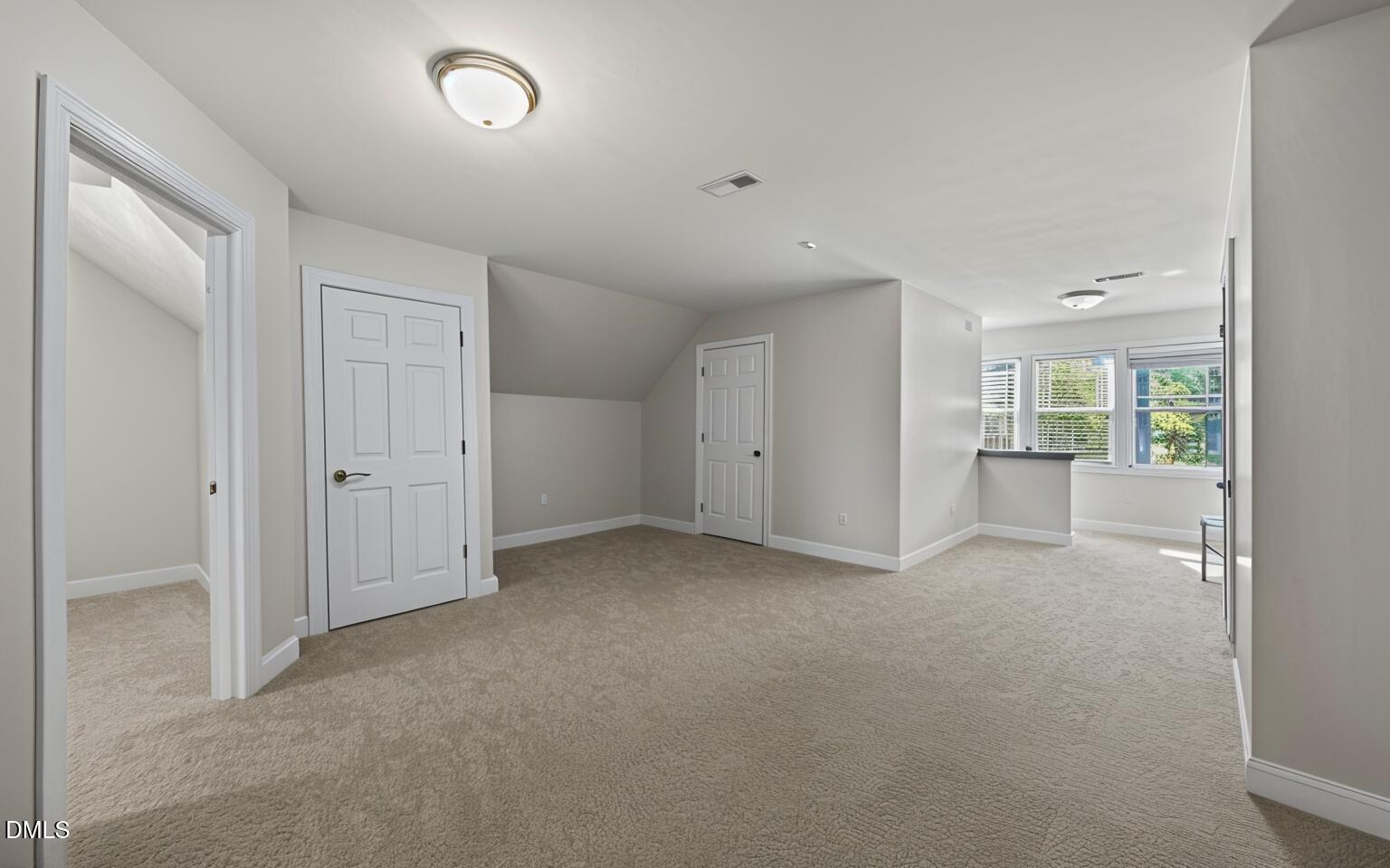 4620 Cresta Drive Raleigh, NC 27603 - Photo 25 of 39 an empty room with a empty space and windows