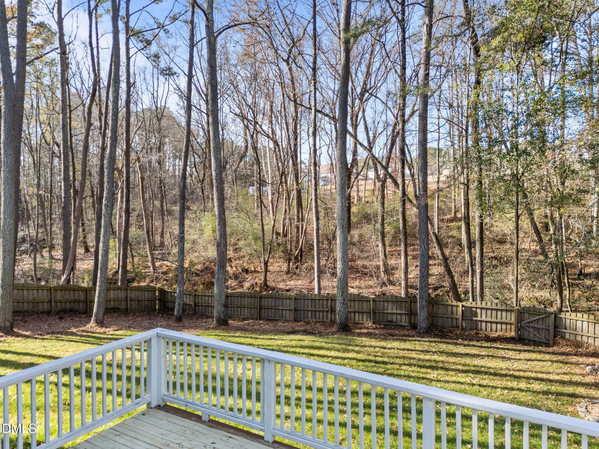 4620 Cresta Drive Raleigh, NC 27603 - Photo 35 of 39 a view of outdoor space with deck and trees
