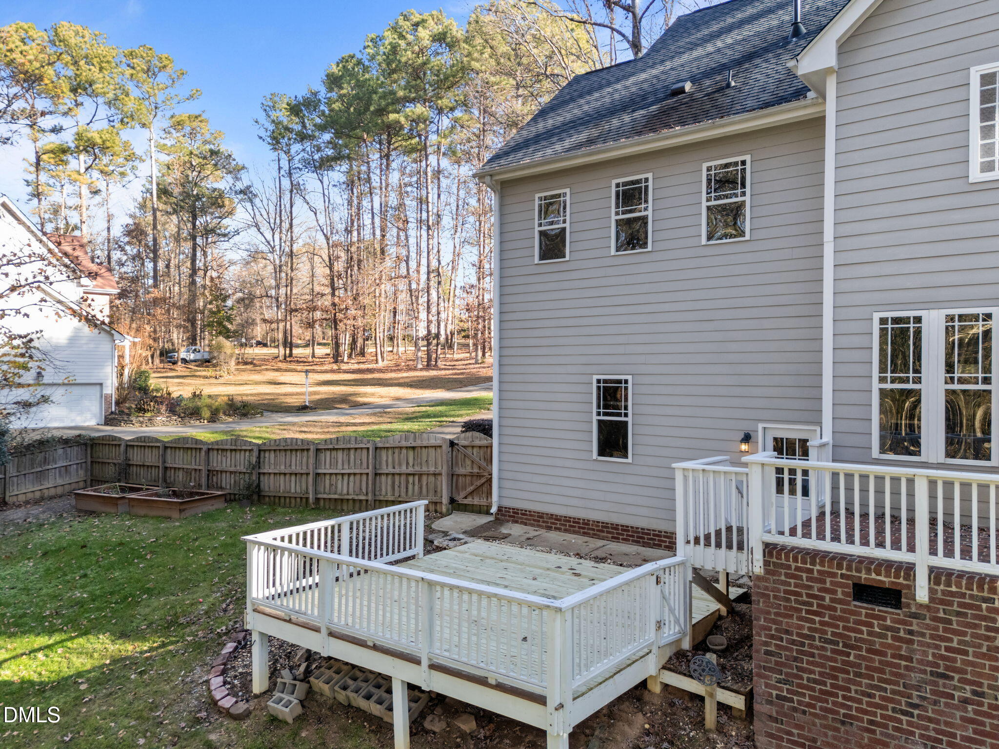 4620 Cresta Drive Raleigh, NC 27603 - Photo 38 of 39 a view of a house with a house and a yard