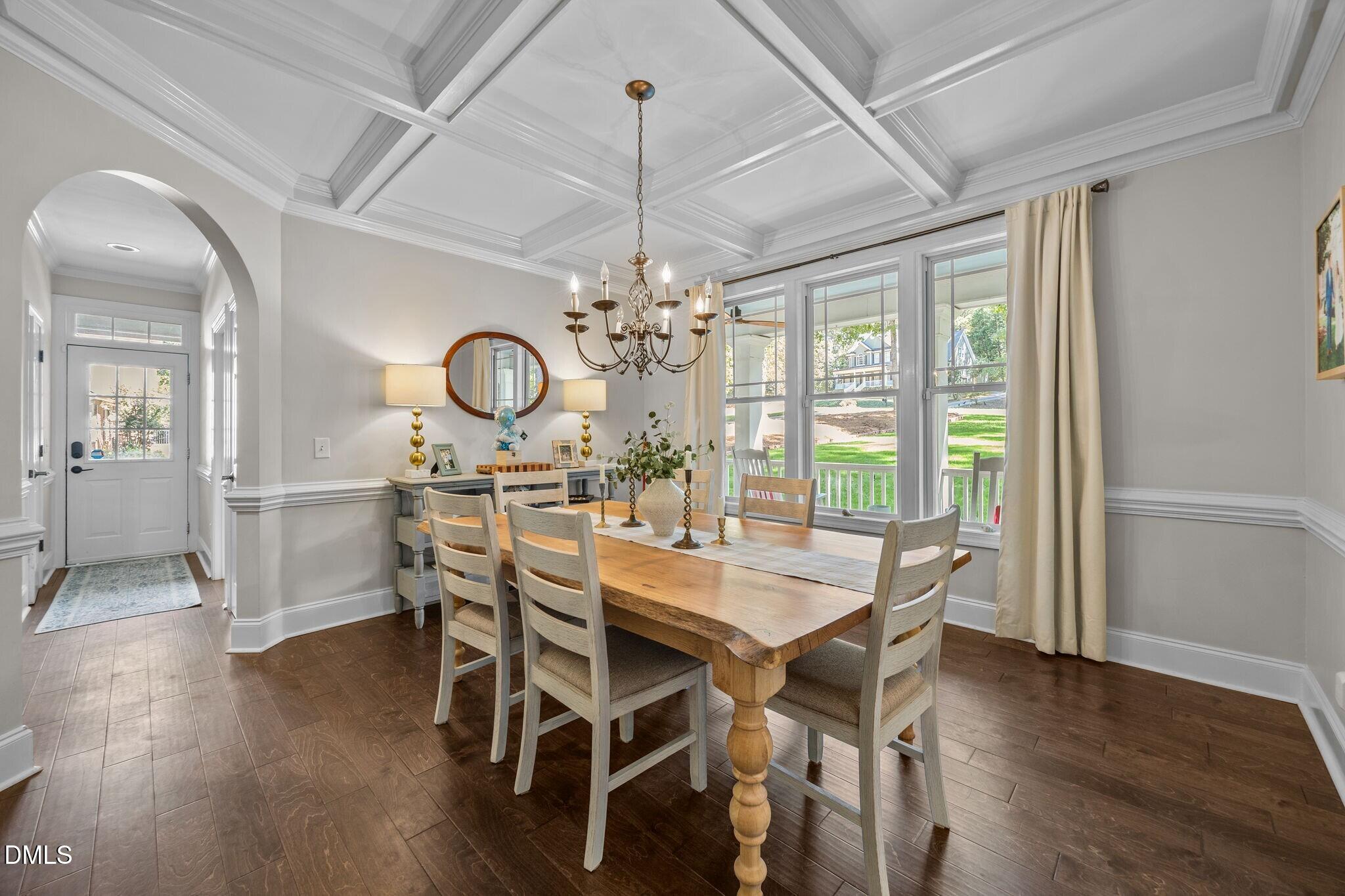 4620 Cresta Drive Raleigh, NC 27603 - Photo 6 of 39 a view of a dining room with furniture window and wooden floor
