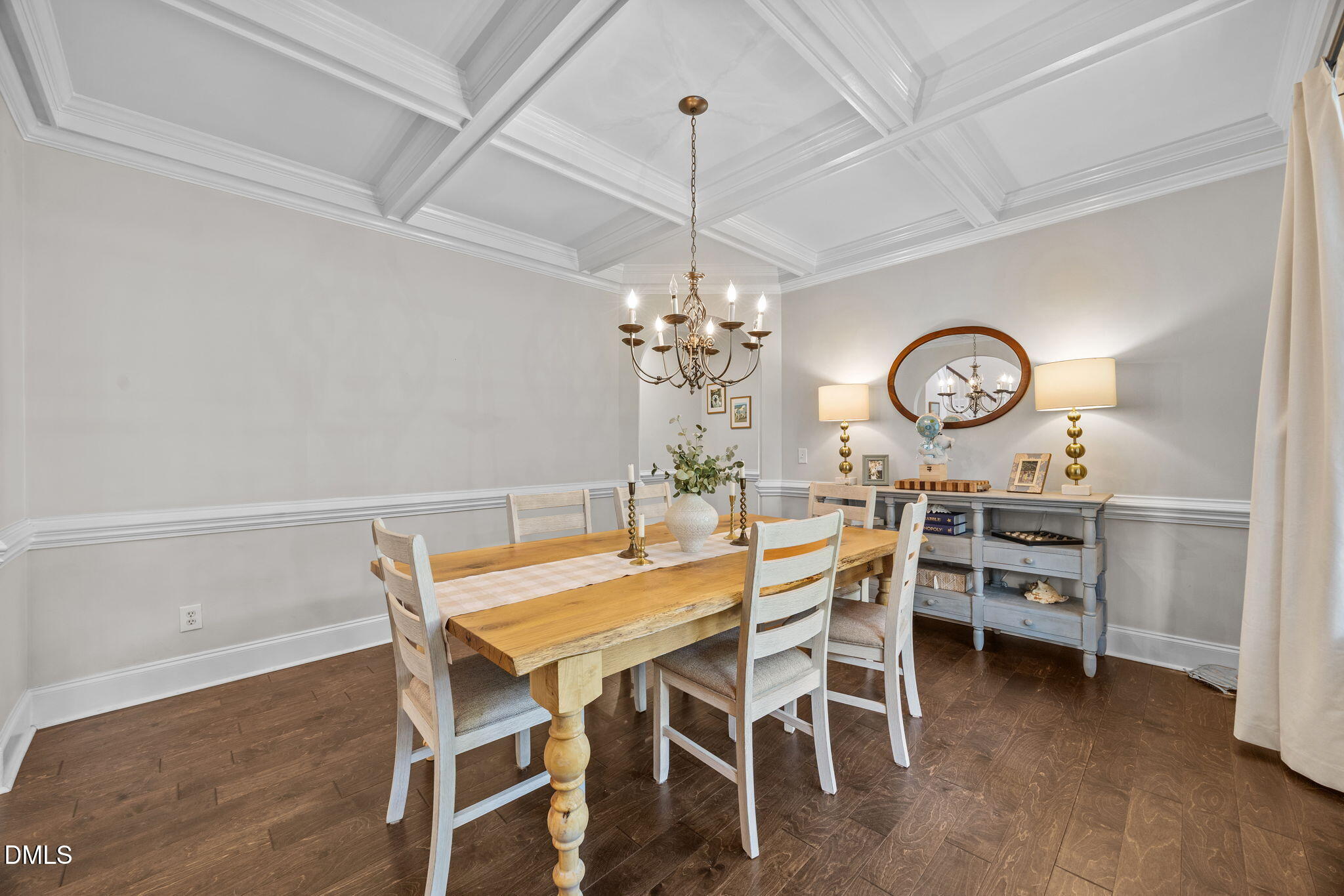4620 Cresta Drive Raleigh, NC 27603 - Photo 7 of 39 a view of a dining room with furniture and a chandelier