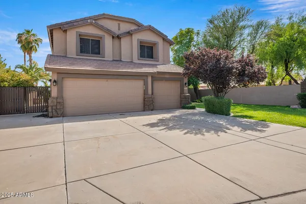 a front view of a house with yard